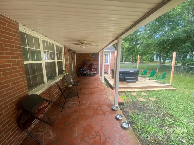 a view of swimming pool with a patio