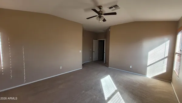 a view of empty room with windows