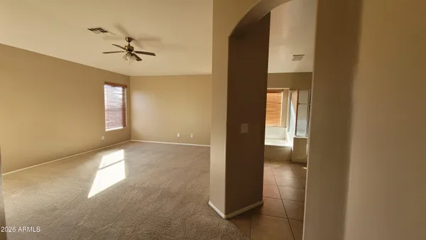 an empty room with closet area