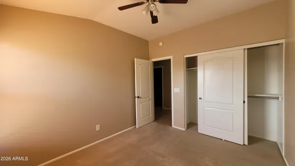 an empty room with a empty space and a window