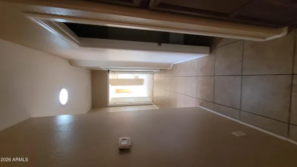 a view of empty room with windows