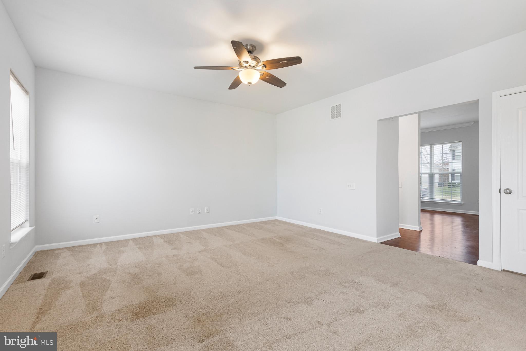 413 Janets Way Townsend, DE 19734 - Photo 12 of 27 a view of a livingroom with a ceiling fan and window