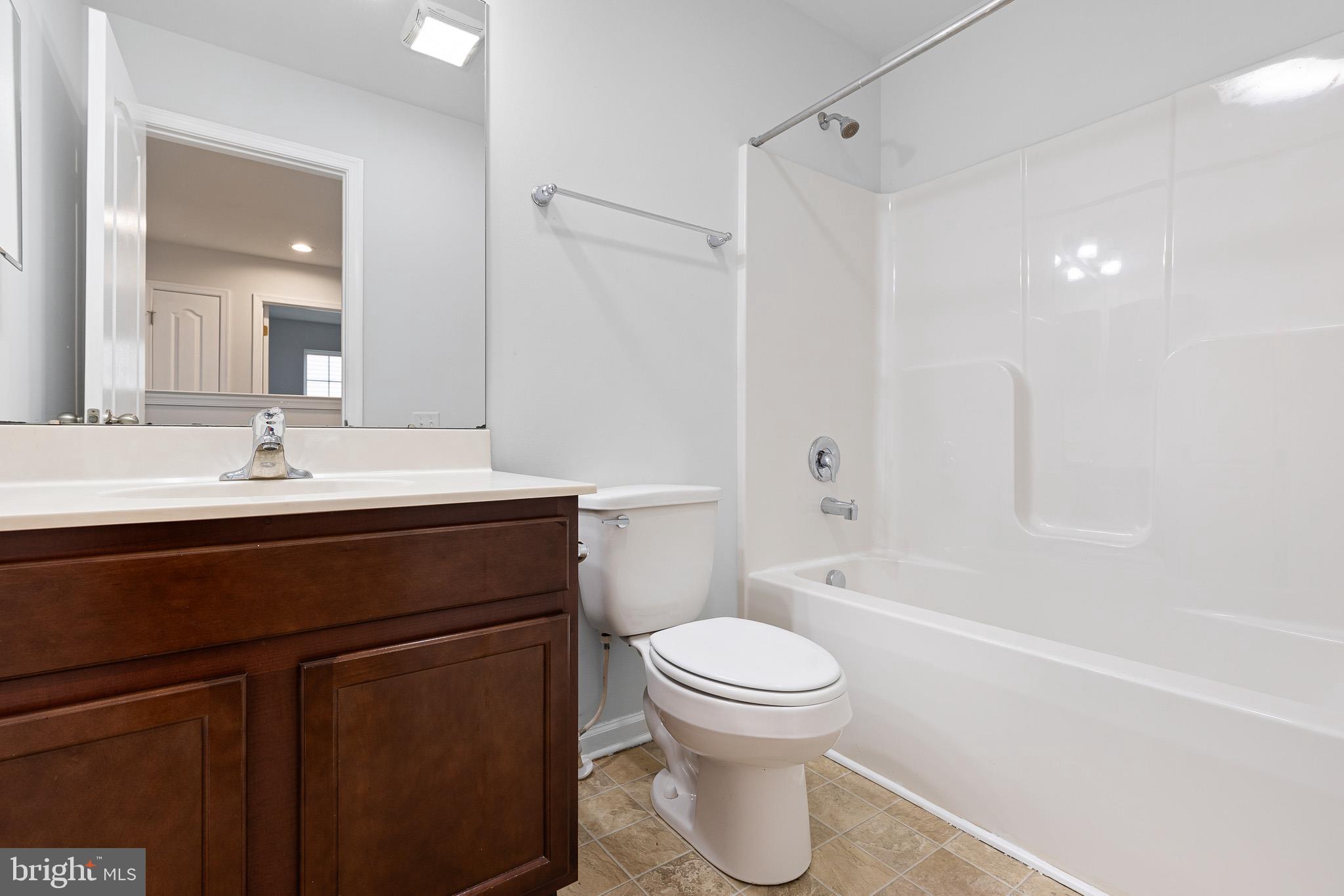 413 Janets Way Townsend, DE 19734 - Photo 15 of 27 a bathroom with a sink a toilet and shower
