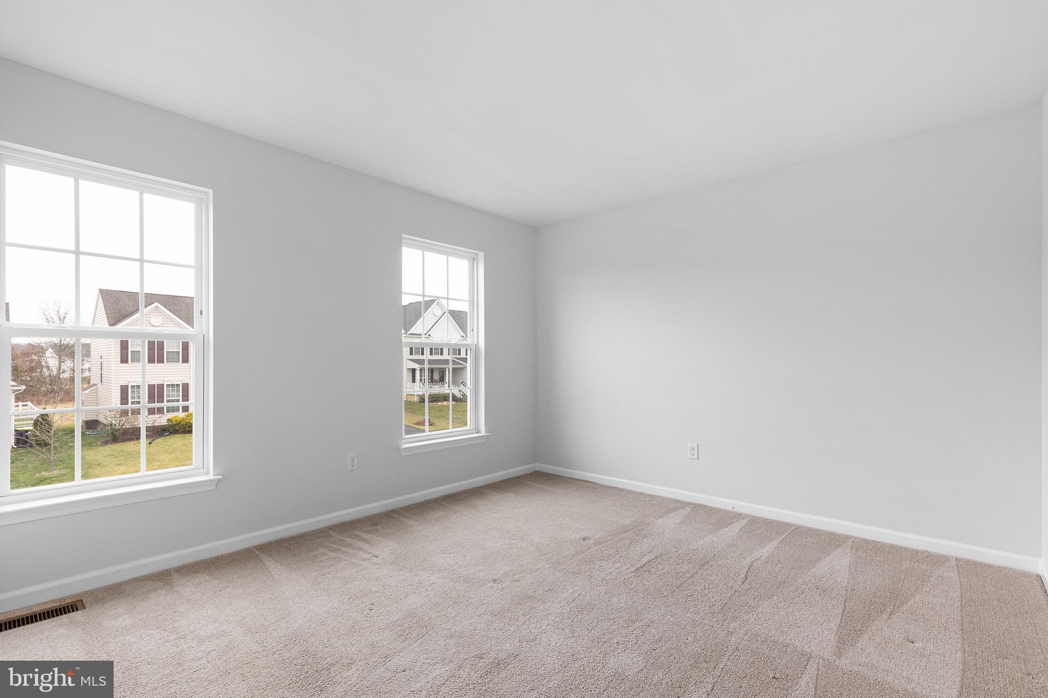 413 Janets Way Townsend, DE 19734 - Photo 17 of 27 an empty room with windows