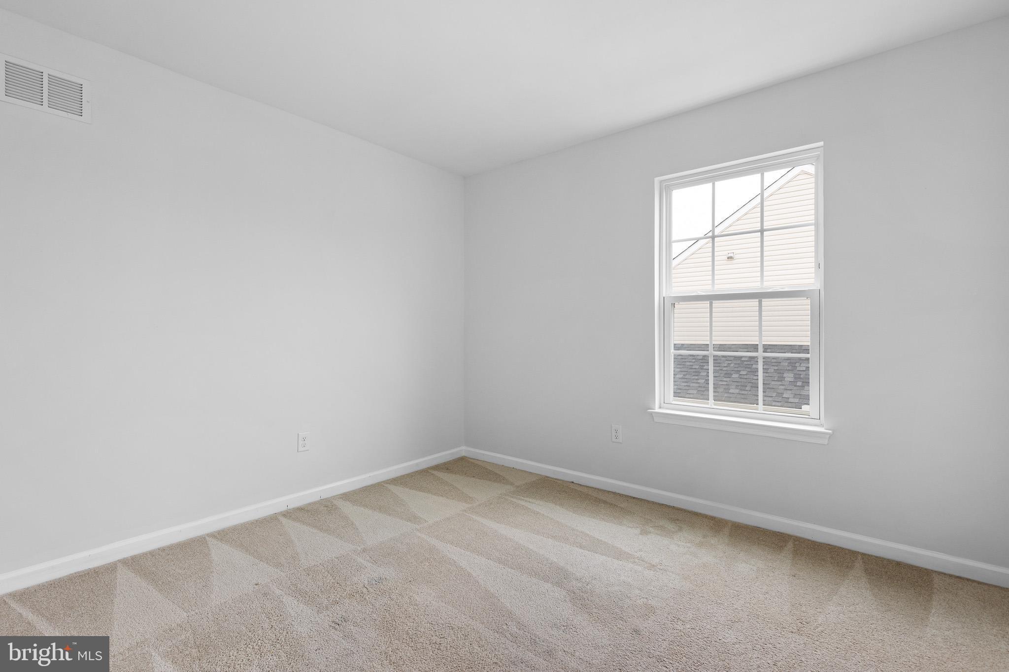 413 Janets Way Townsend, DE 19734 - Photo 21 of 27 an empty room with a window