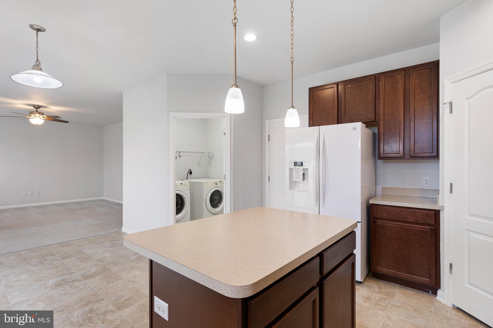 413 Janets Way Townsend, DE 19734 - Photo 8 of 27 a kitchen with a refrigerator a sink and dishwasher