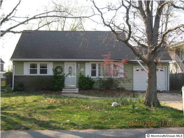 1305 Mossbank Road Point Pleasant, NJ 08742 - Photo 1 of 1 a front view of a house with garden