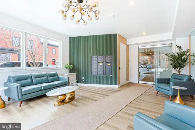 a living room with furniture and a large window
