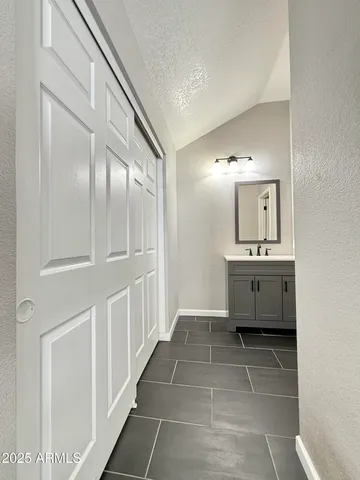 a bathroom with a sink a mirror and a bathtub