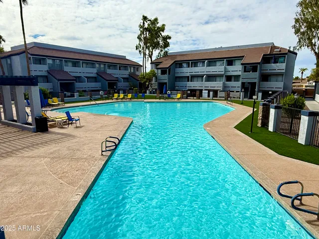a view of a house with a yard patio and a slide