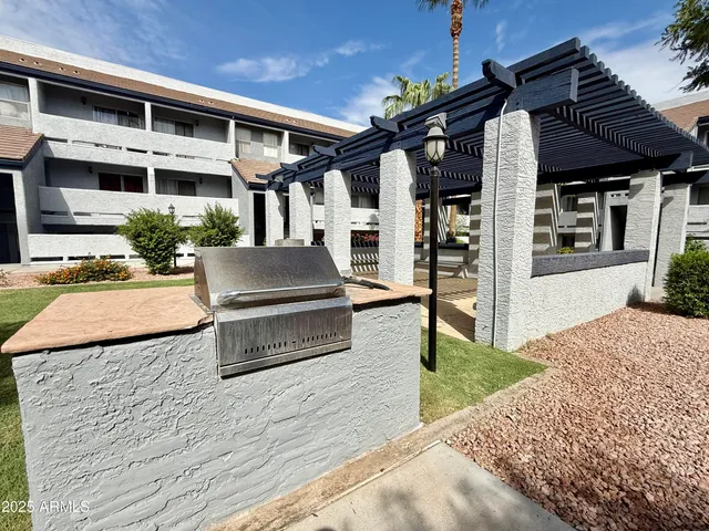 a view of a balcony with next to a yard