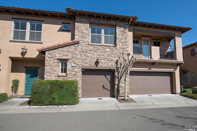 a front view of a house with garage