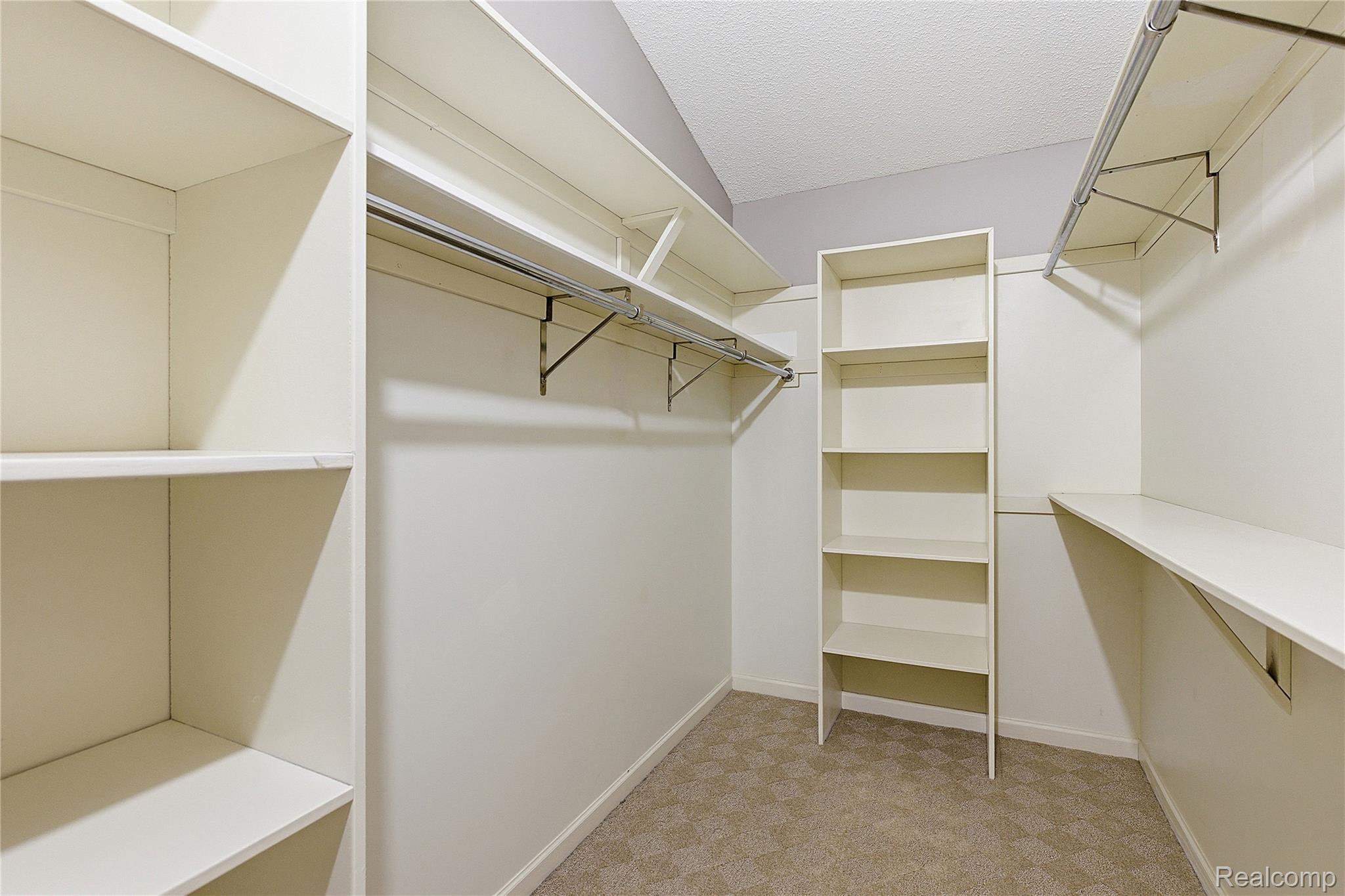 7154 Westchester Road West Bloomfield, MI 48322 - Photo 24 of 38 Spacious closet featuring light carpet