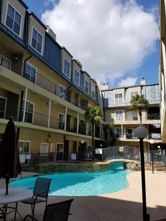 a view of a building with a yard