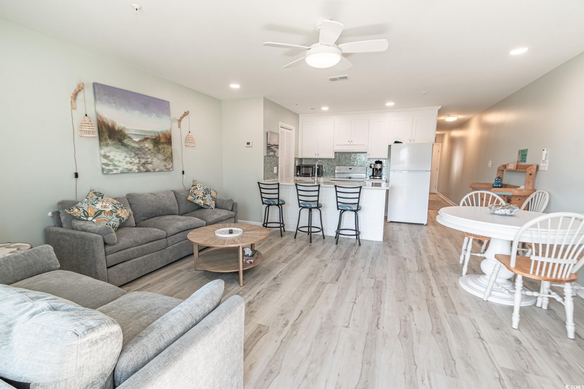 1210 North Ocean Boulevard, Unit 203 Surfside Beach, SC 29575 - Photo 11 of 27 Living room with a ceiling fan, light wood finished floors, and recessed lighting
