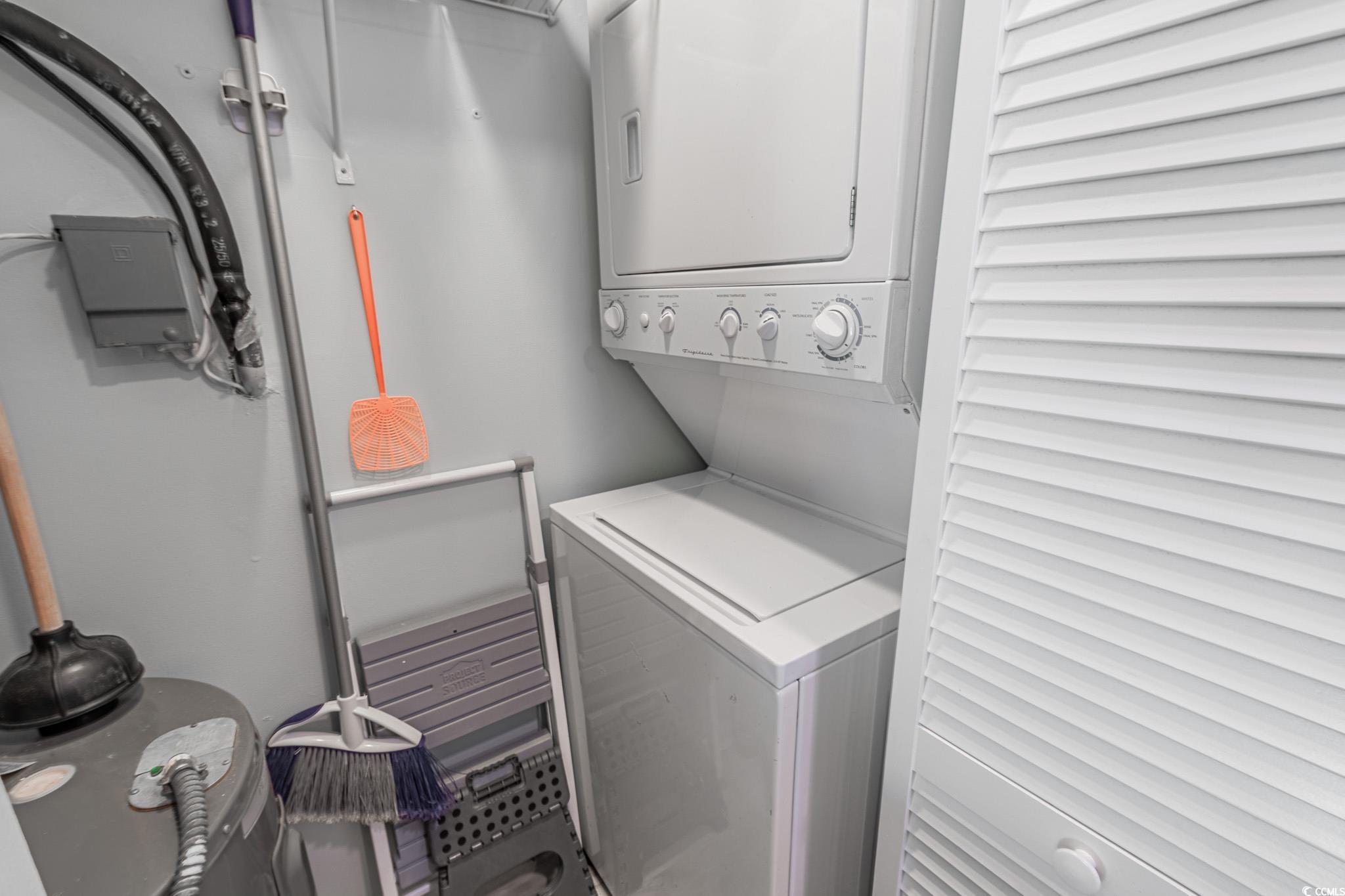 1210 North Ocean Boulevard, Unit 203 Surfside Beach, SC 29575 - Photo 12 of 27 Laundry area featuring stacked washing machine and dryer