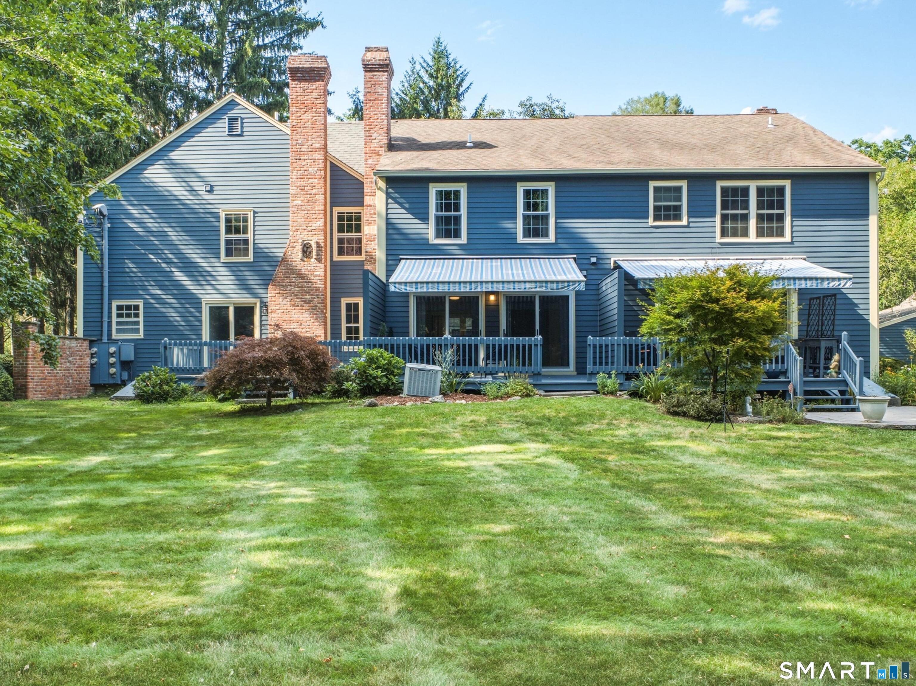 3 Esterly Farms Road, Unit 3 Madison, CT 06443 - Photo 2 of 37 Back side. #3 is the middle unit with 2 sliders to the deck