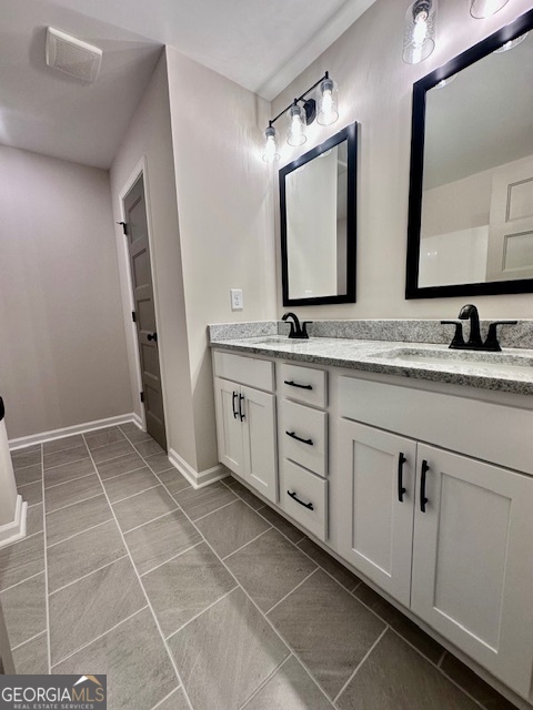 30 Shadybrook Path Newnan, GA 30263 - Photo 14 of 26 a bathroom with a double vanity sink and mirror
