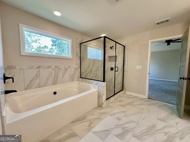 30 Shadybrook Path Newnan, GA 30263 - Photo 19 of 26 a bathroom with a bathtub and a shower