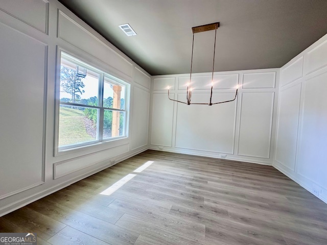 30 Shadybrook Path Newnan, GA 30263 - Photo 3 of 26 an empty room with wooden floor fan and windows