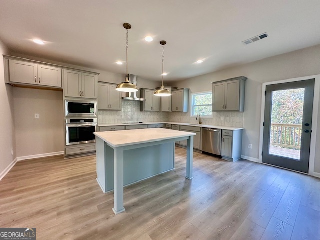 30 Shadybrook Path Newnan, GA 30263 - Photo 7 of 26 a large kitchen with stainless steel appliances granite countertop a stove a sink dishwasher a refrigerator white cabinets and wooden floor next to a window