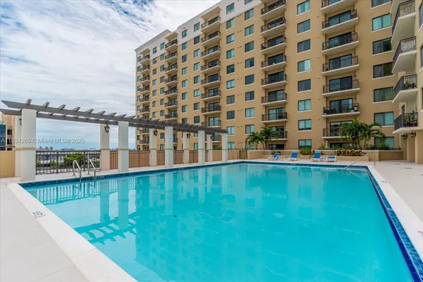 a view of building with swimming pool