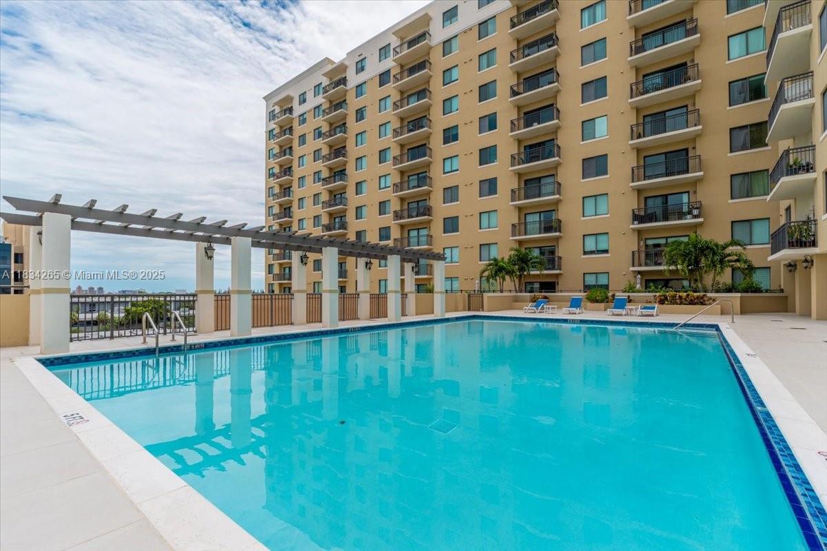 4242 Northwest 2nd Street, Unit 1601 Miami, FL 33126 - Photo 26 of 37 a view of building with swimming pool