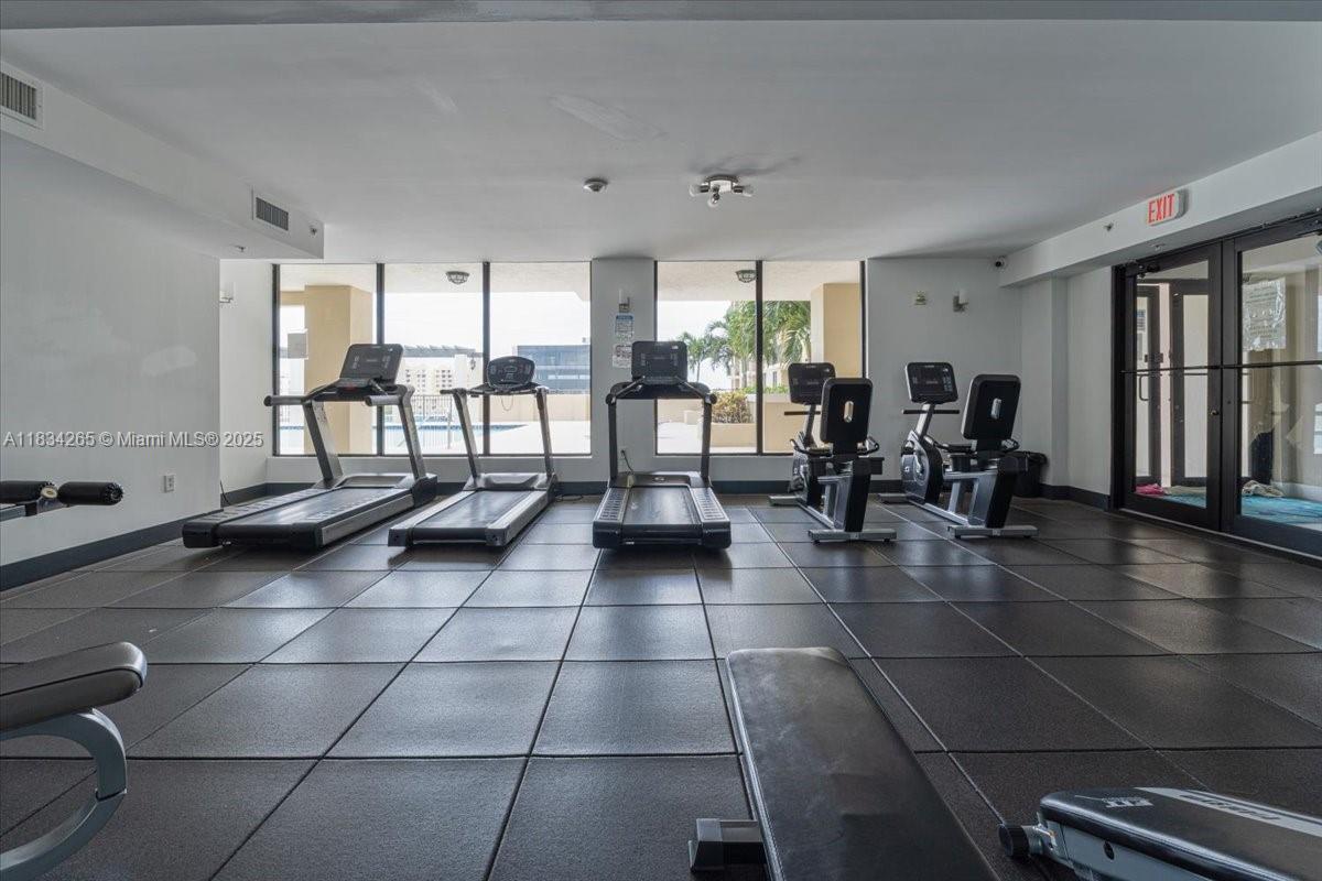 4242 Northwest 2nd Street, Unit 1601 Miami, FL 33126 - Photo 34 of 37 a lobby with furniture and floor to ceiling window