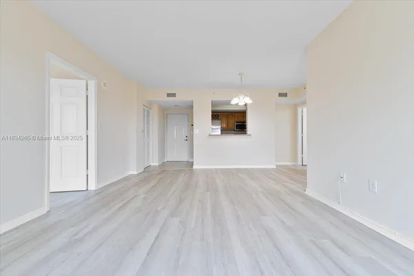 a view of a livingroom with wooden floor
