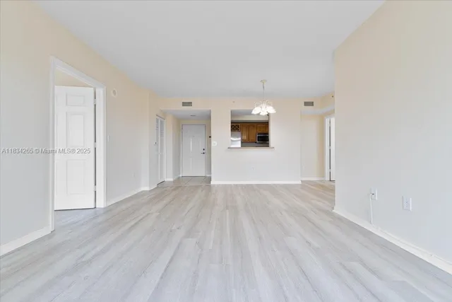 a view of a livingroom with wooden floor