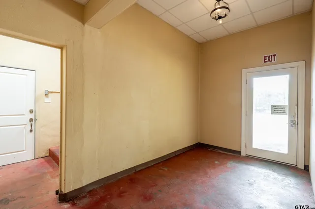 an empty room with windows