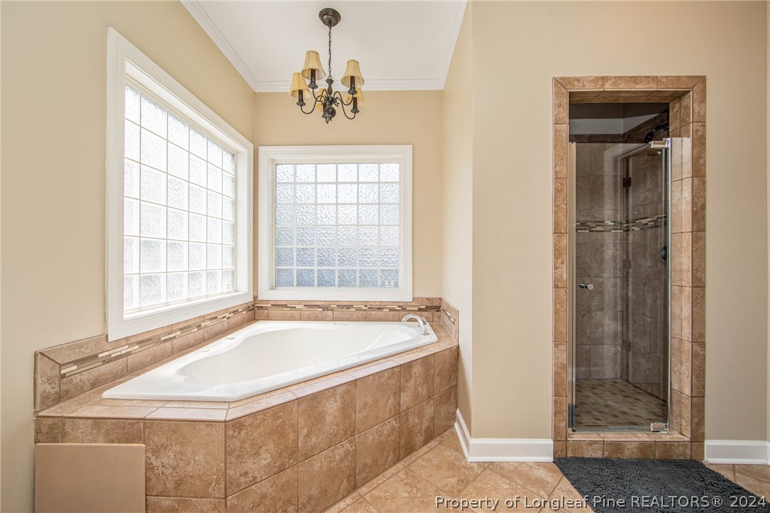 3304 Geyser Peak Road Fayetteville, NC 28306 - Photo 24 of 39 a spacious bathroom with sink shower and bathtub