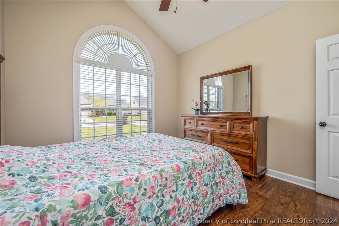 3304 Geyser Peak Road Fayetteville, NC 28306 - Photo 27 of 39 a bedroom with a bed and a dresser next to a window
