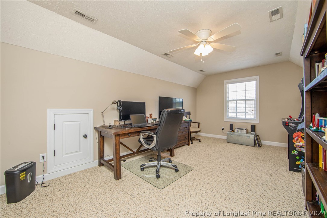 3304 Geyser Peak Road Fayetteville, NC 28306 - Photo 34 of 39 a workspace with furniture and a window