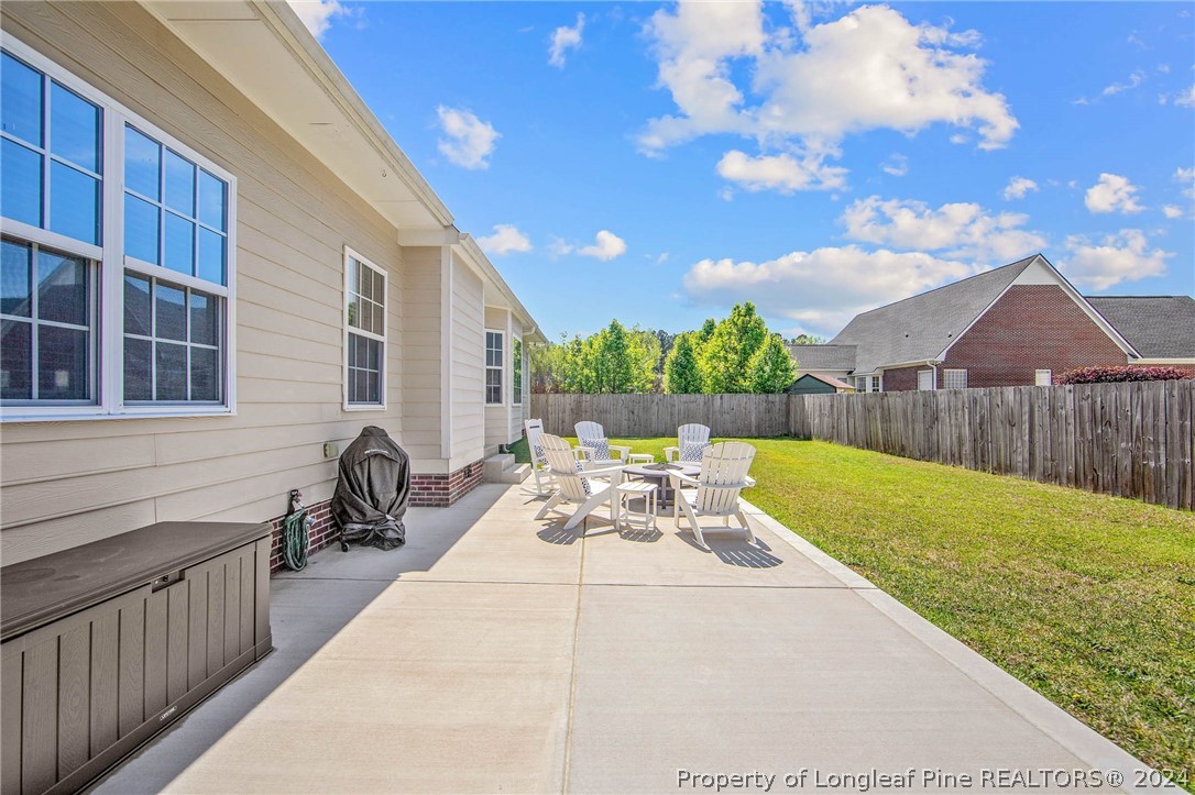 3304 Geyser Peak Road Fayetteville, NC 28306 - Photo 5 of 39 a view of a patio with a table and chairs