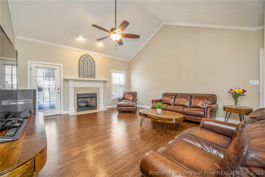 3304 Geyser Peak Road Fayetteville, NC 28306 - Photo 6 of 39 a living room with furniture and a fireplace