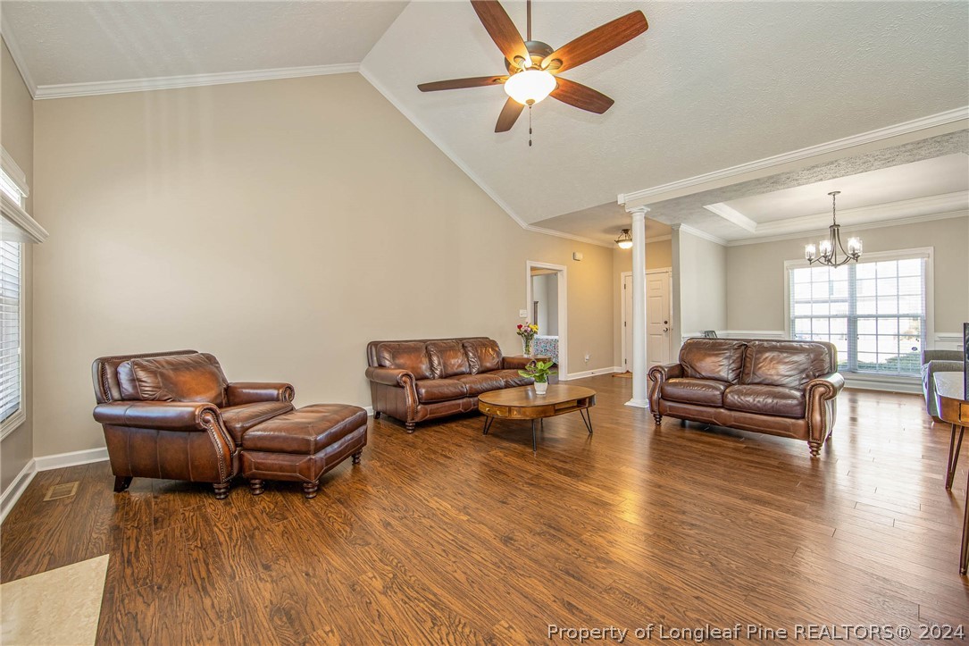 3304 Geyser Peak Road Fayetteville, NC 28306 - Photo 8 of 39 a living room with furniture and a wooden floor