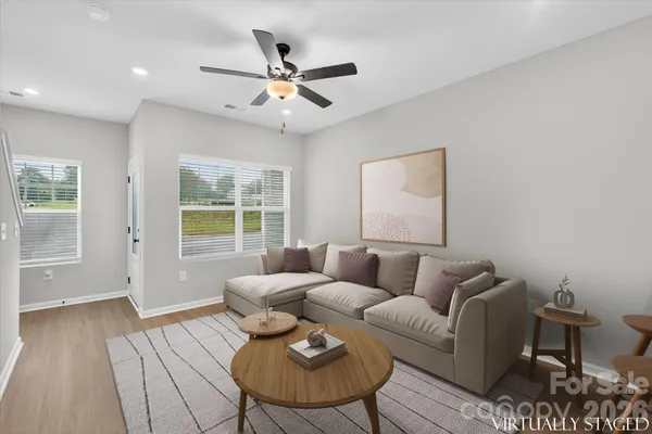 a living room with furniture and a window