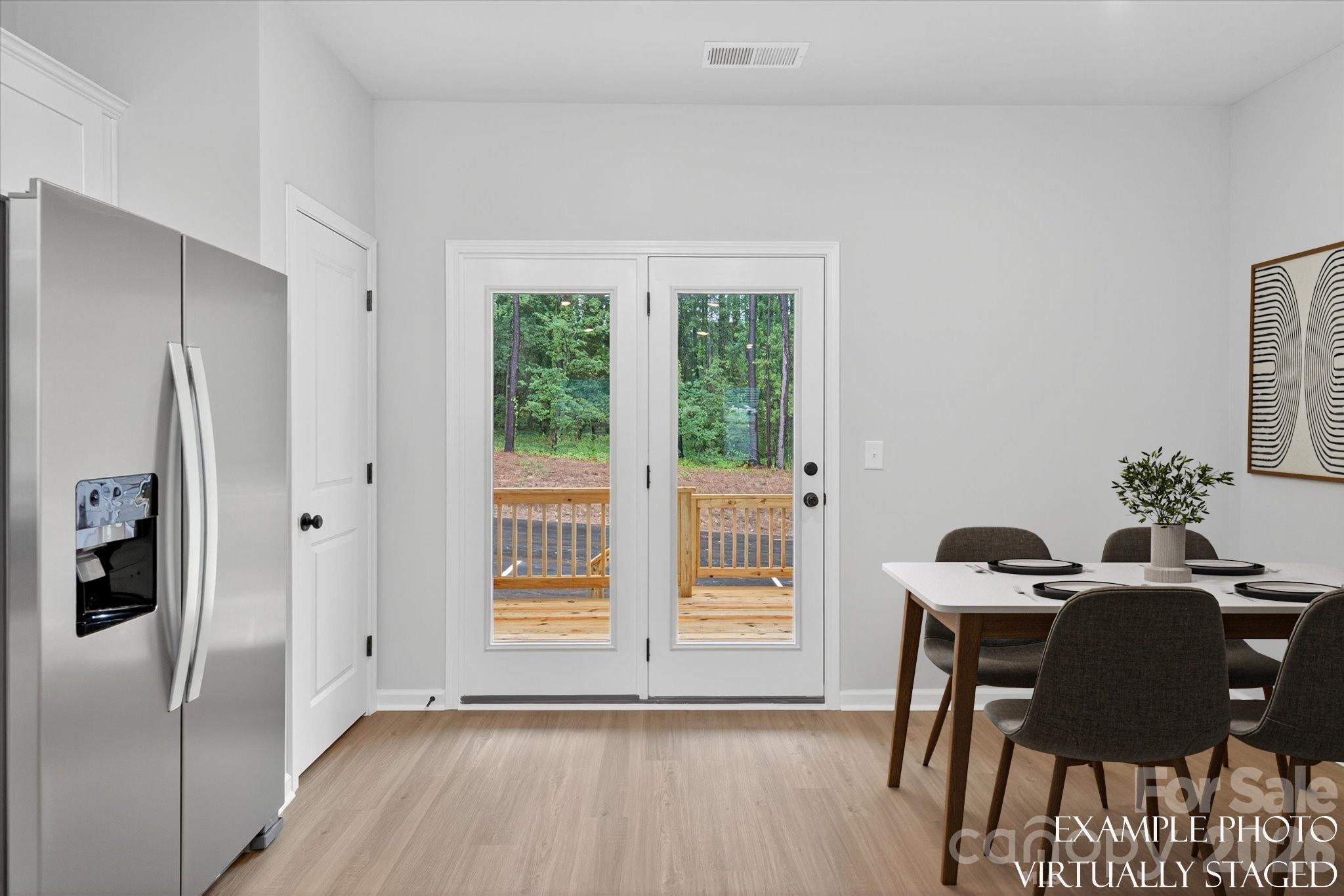 1219 Signal Street Gastonia, NC 28052 - Photo 6 of 16 a view of a dining room with furniture and wooden floor