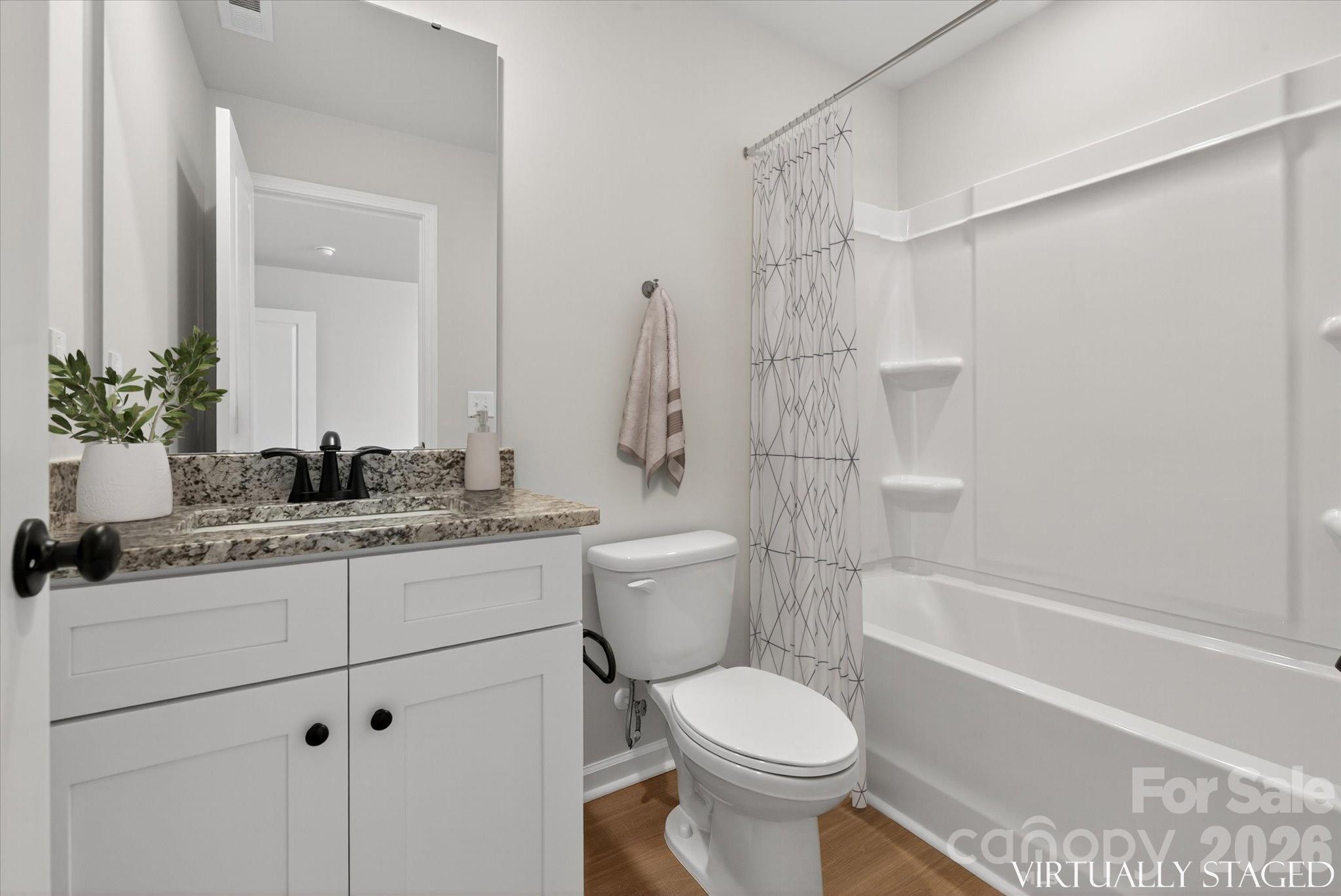 1219 Signal Street Gastonia, NC 28052 - Photo 10 of 16 a bathroom with a granite countertop sink toilet and shower
