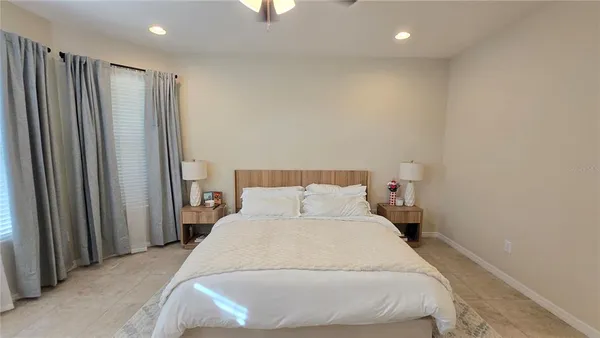 a bedroom with a bed and a mirror