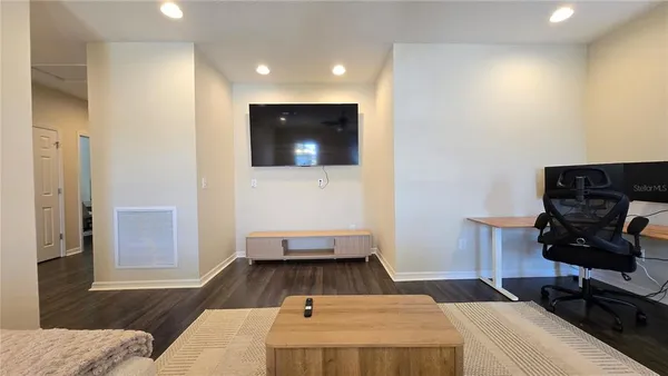 a room with a bed and furniture
