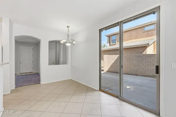 a view of a kitchen with stainless steel appliances granite countertop a sink and dishwasher a stove top oven with wooden floor