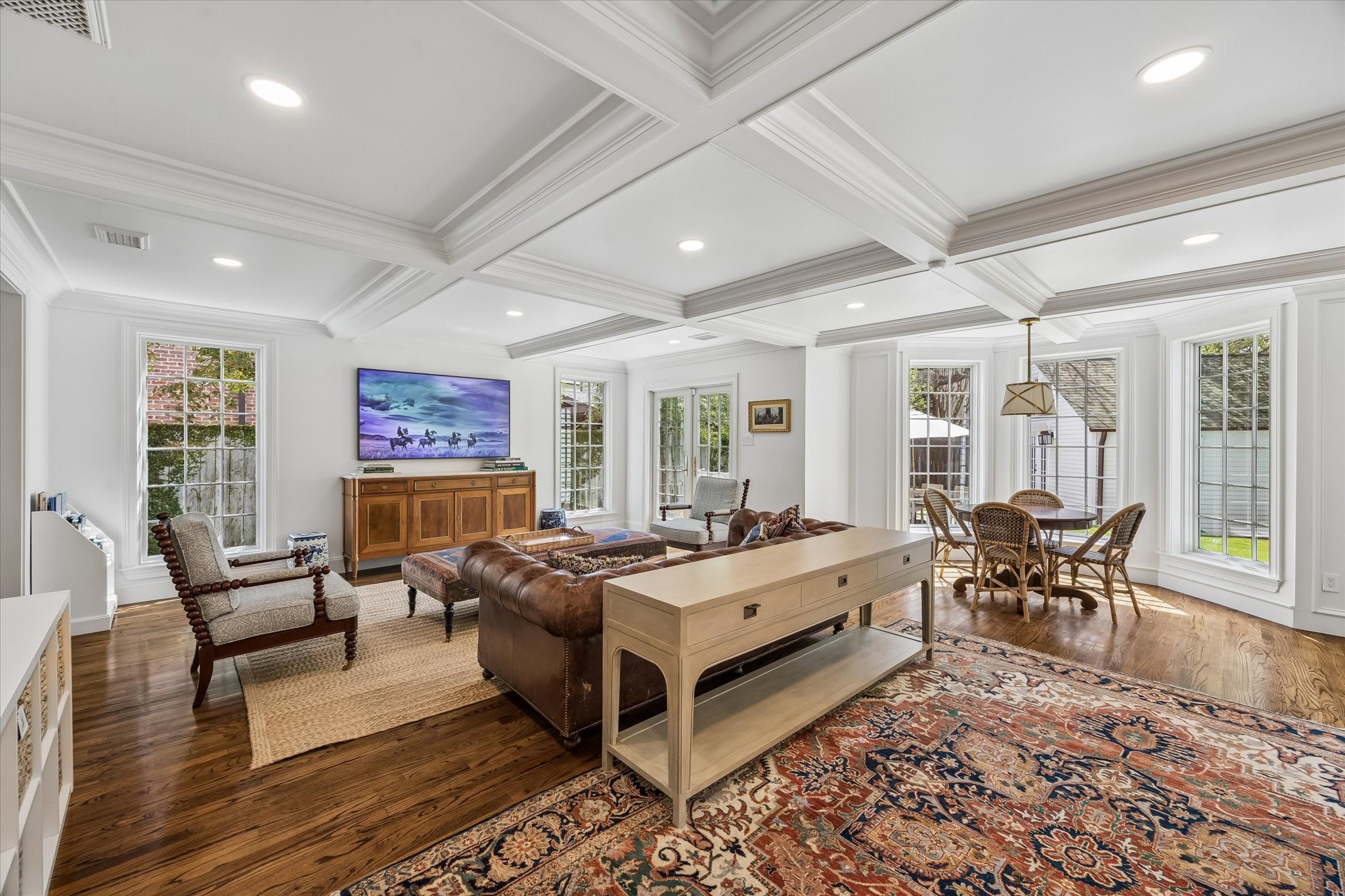 2153 Looscan Lane Houston, TX 77019 - Photo 11 of 48 Large Family Room with full view of the back yard. Notice the ceiling paneled beams adding charm and character to this gorgeous property
