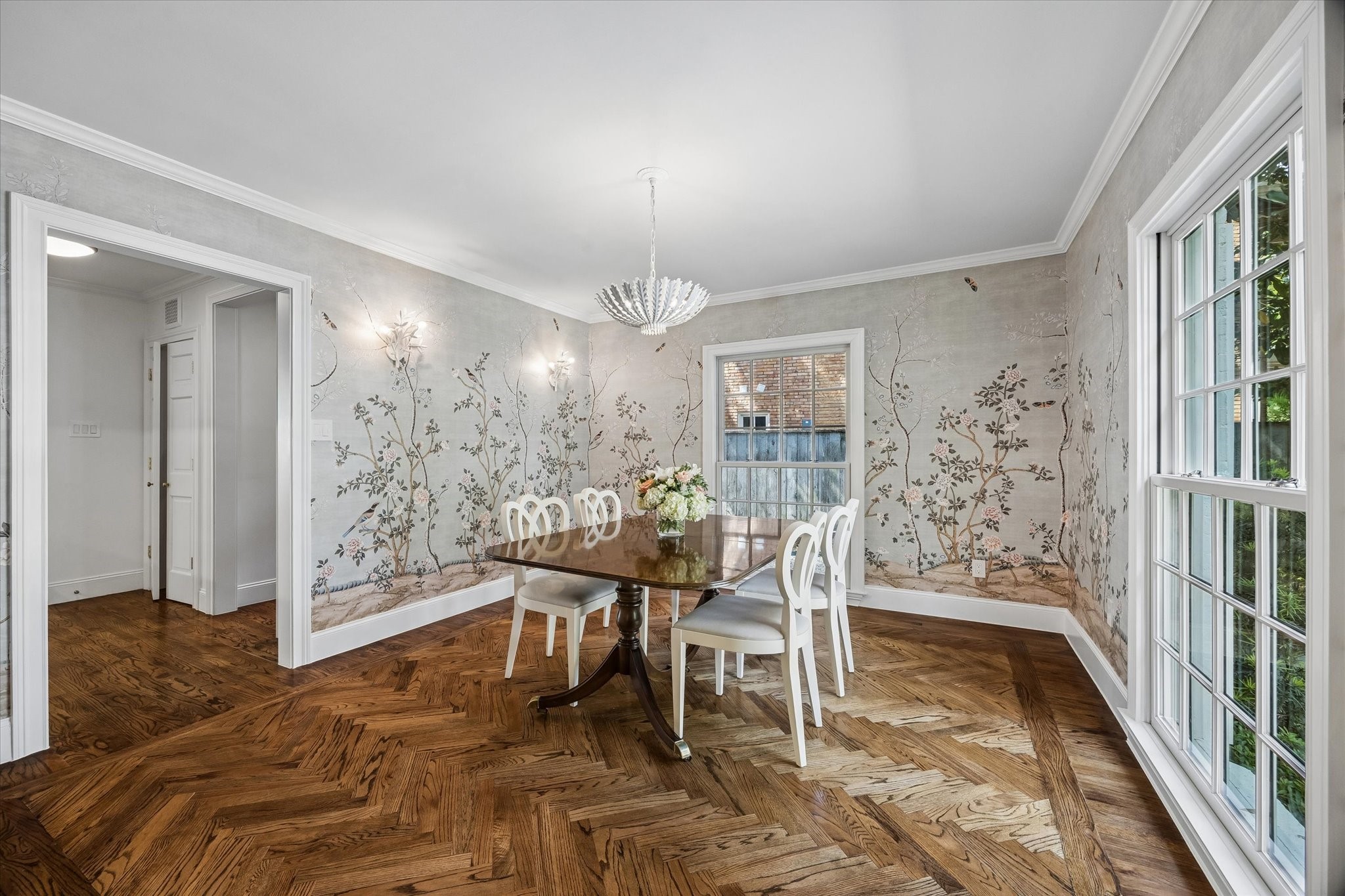 2153 Looscan Lane Houston, TX 77019 - Photo 6 of 48 The Dining Room is located on the front of the house and also has the beautiful herringbone wood floors, designer light fixture, and wallpaper