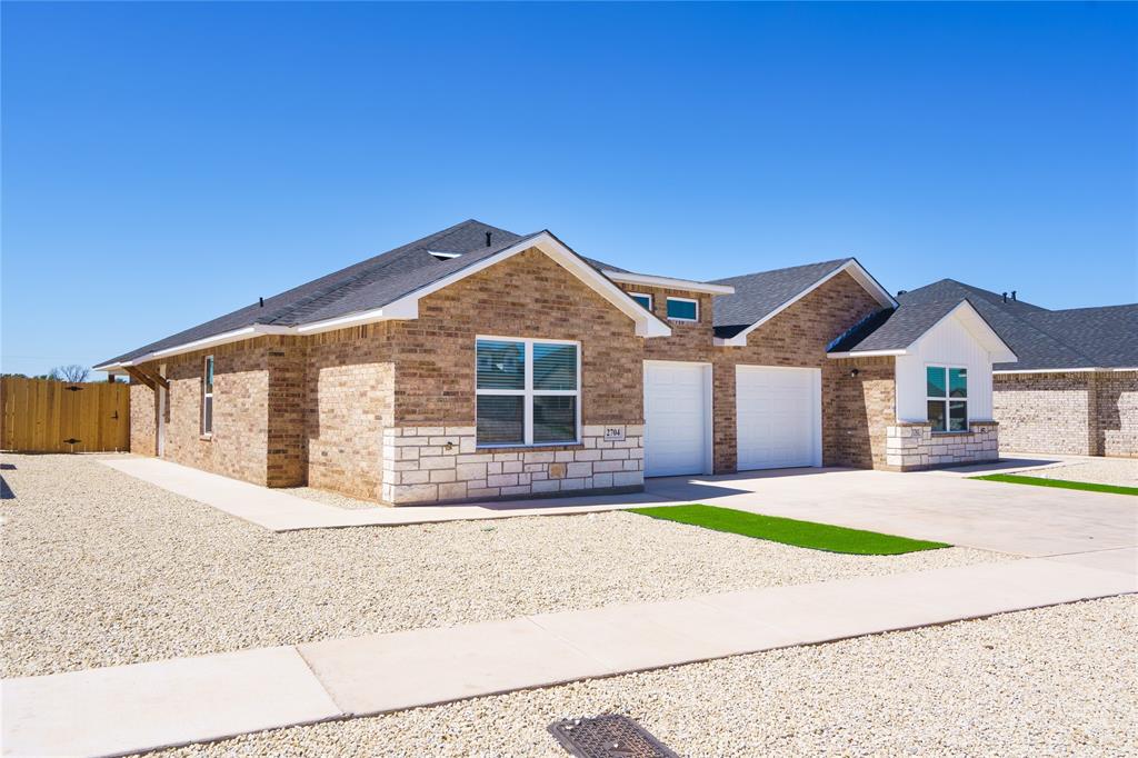 2610 Roman Lane Abilene, TX 79606 - Photo 2 of 17 a front view of a house with a yard and garage