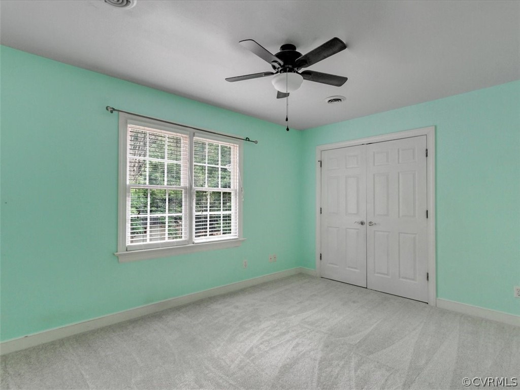 13110 Carters Way Road Chesterfield, VA 23838 - Photo 23 of 31 a view of a livingroom with a ceiling fan and windows