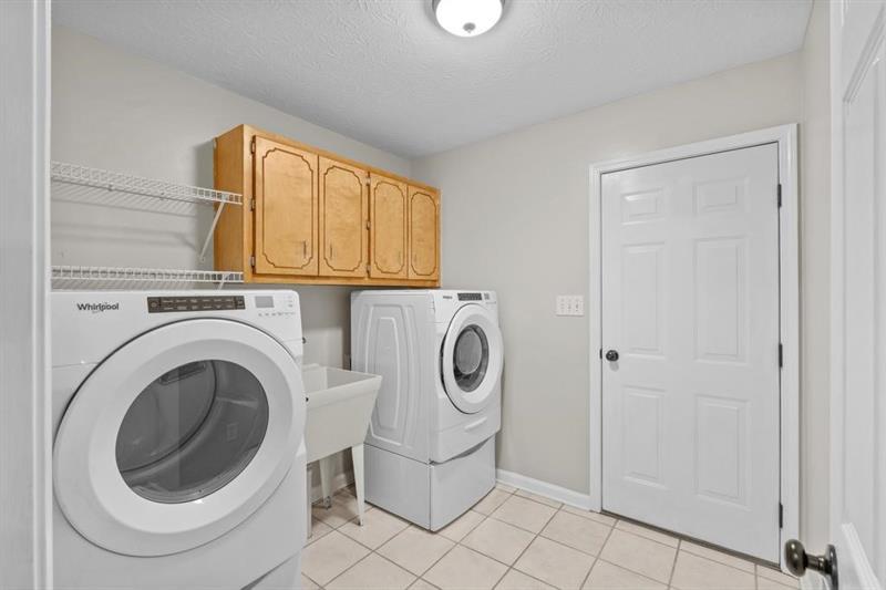 212 Wimberly Ridge McDonough, GA 30253 - Photo 25 of 44 a utility room with dryer and washer