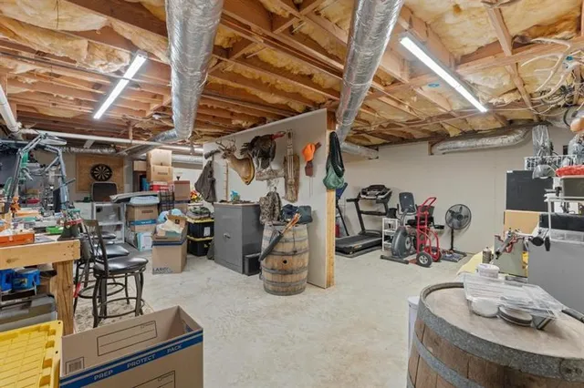 a view of a storage room with water heater and racks