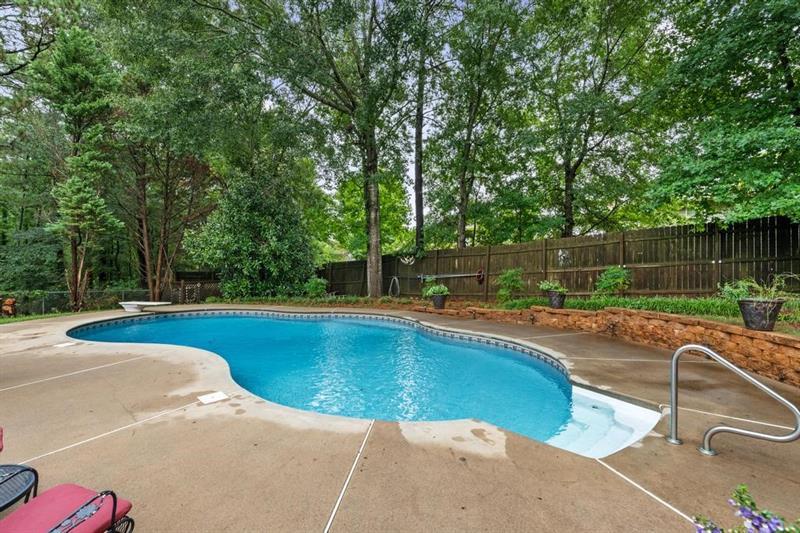 212 Wimberly Ridge McDonough, GA 30253 - Photo 40 of 44 a view of a swimming pool with a patio